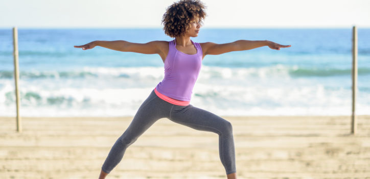 Women performing yoga and using adaptogens for workout endurance and recovery.