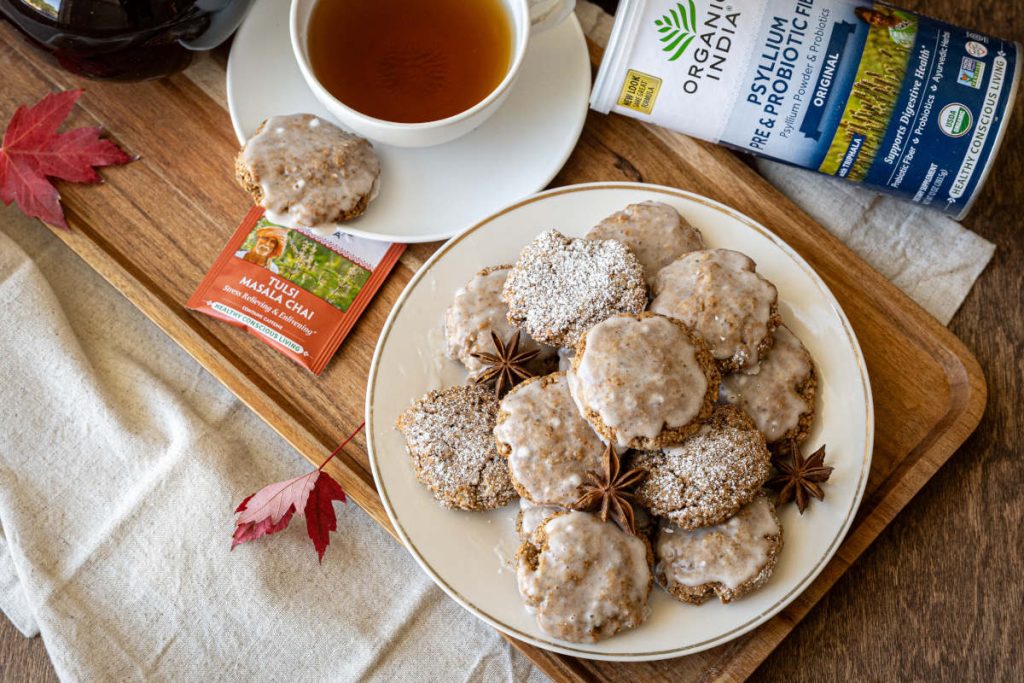 Chai spice cookies on white plate with chai tea