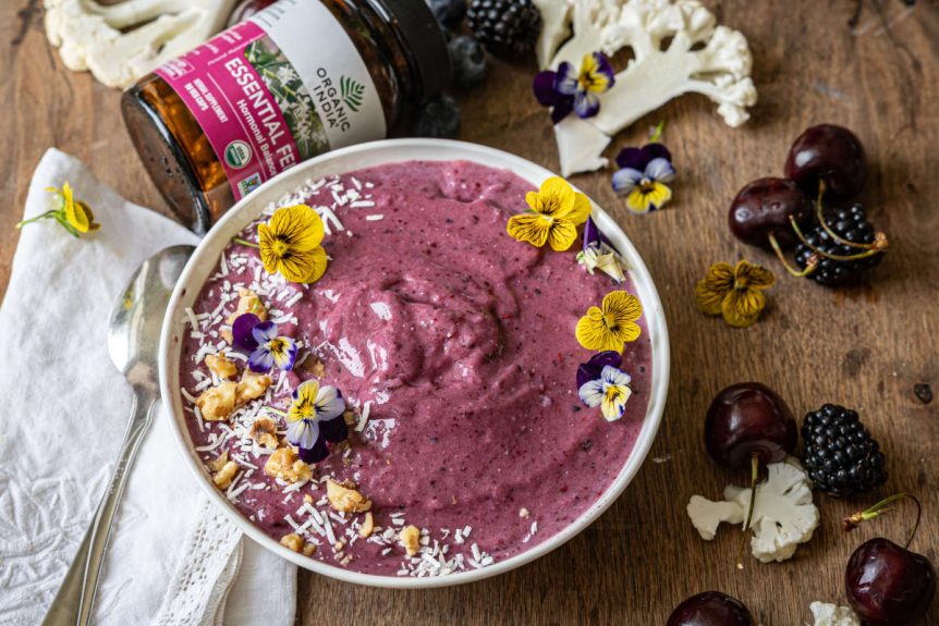 Cherry hormone-balancing smoothie bowl with flower garnish