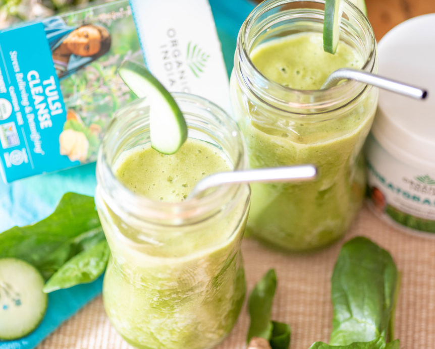 Detox green smoothie featuring herbal cleanse tea and wheatgrass.