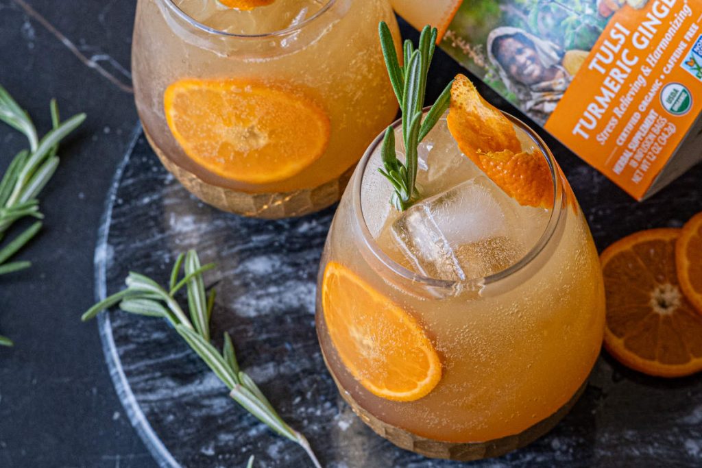 ginger mocktail mule with orange and rosemary garnish