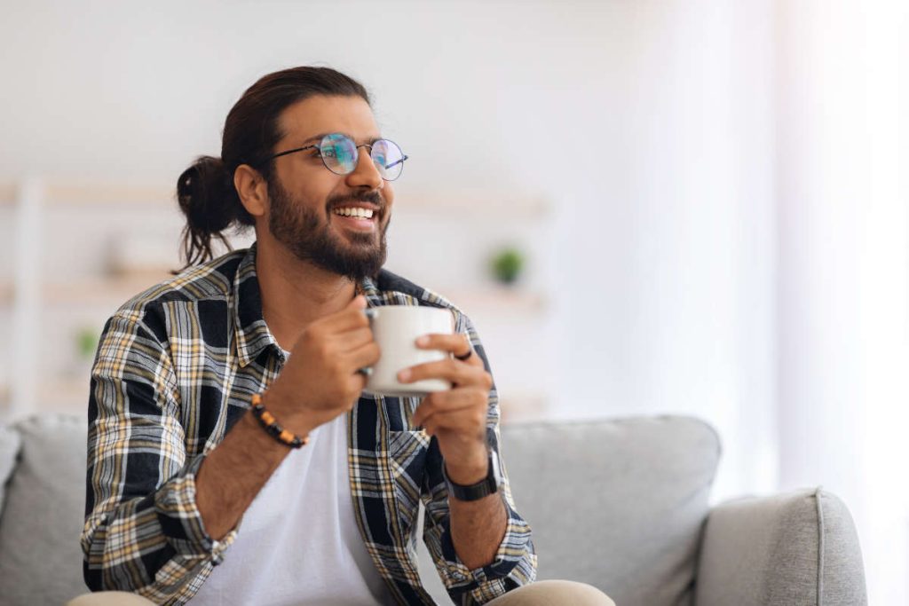 Man drinking a cup of tea for immunity and gut health