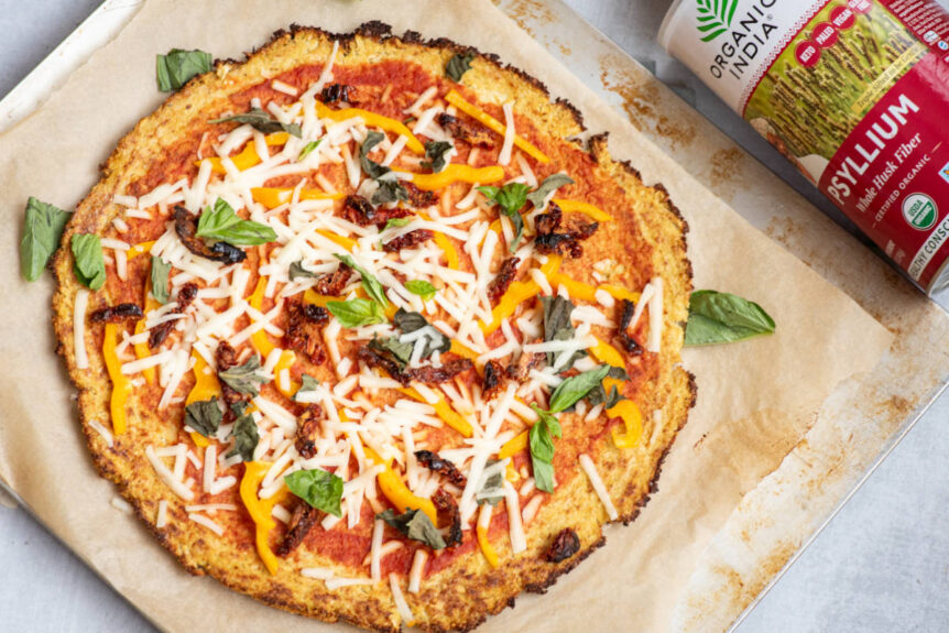 cauliflower psyllium pizza crust topped with vegan cheese, basil and sundried tomatoes.