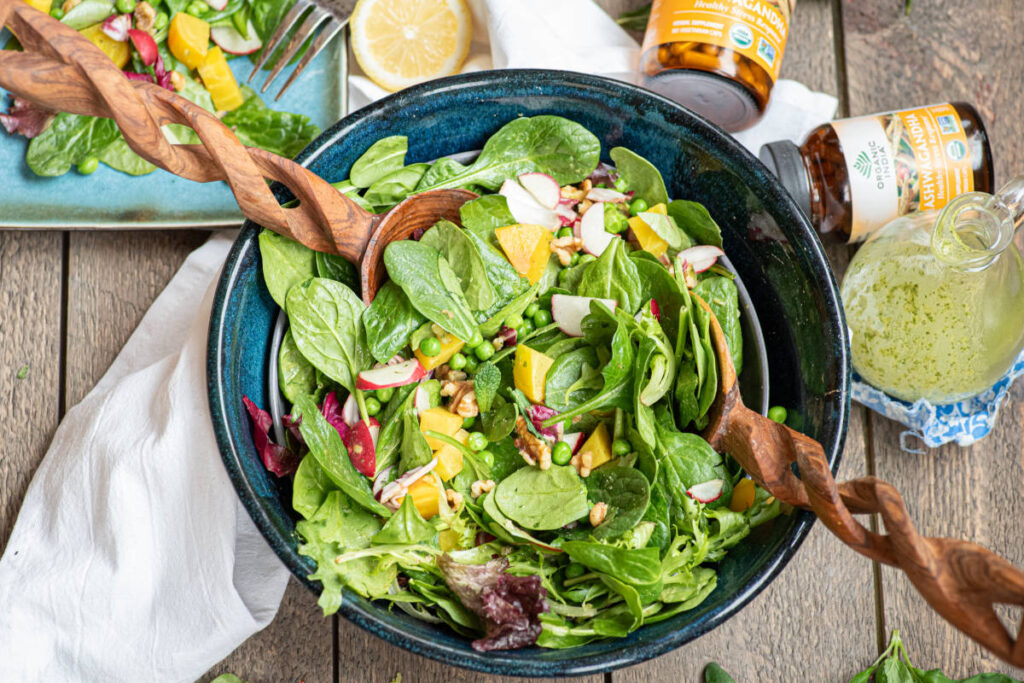 Salad of beets, peas, spring greens and more topped with a freshly homemade ashwagandha vinaigrette.