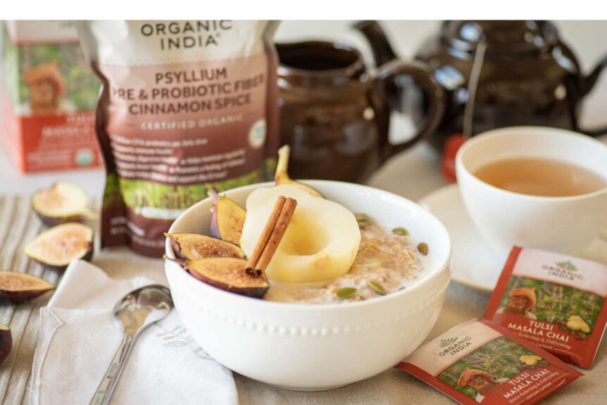 Autumn spiced psyllium oatmeal with poached pear and cinnamon stick garnish