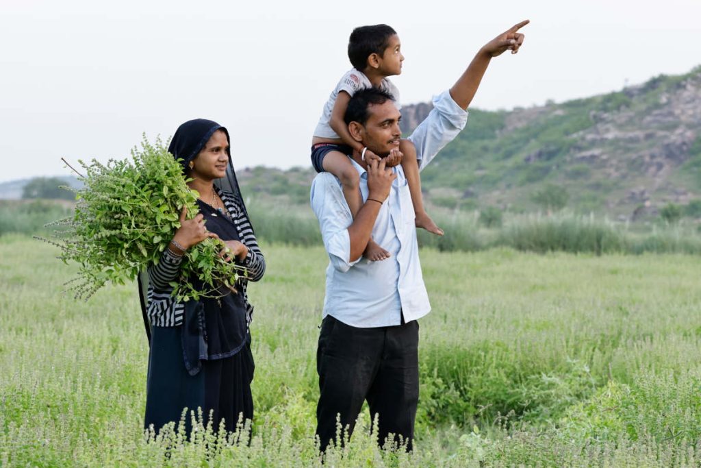 Family on regenerative organic Tulsi farm in rural India, photo by Organic India USA