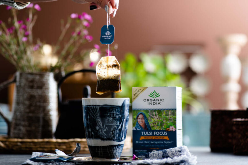 Used tea bag over a ceramic cup
