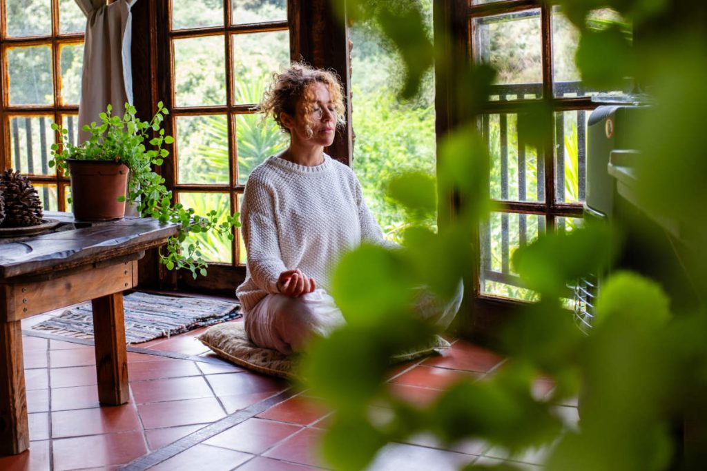 Woman practicing a balancing meditation